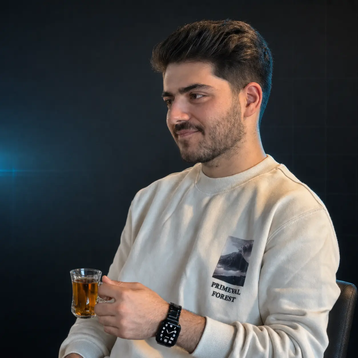 Shervin Qasemzade in a dark editorial studio portrait